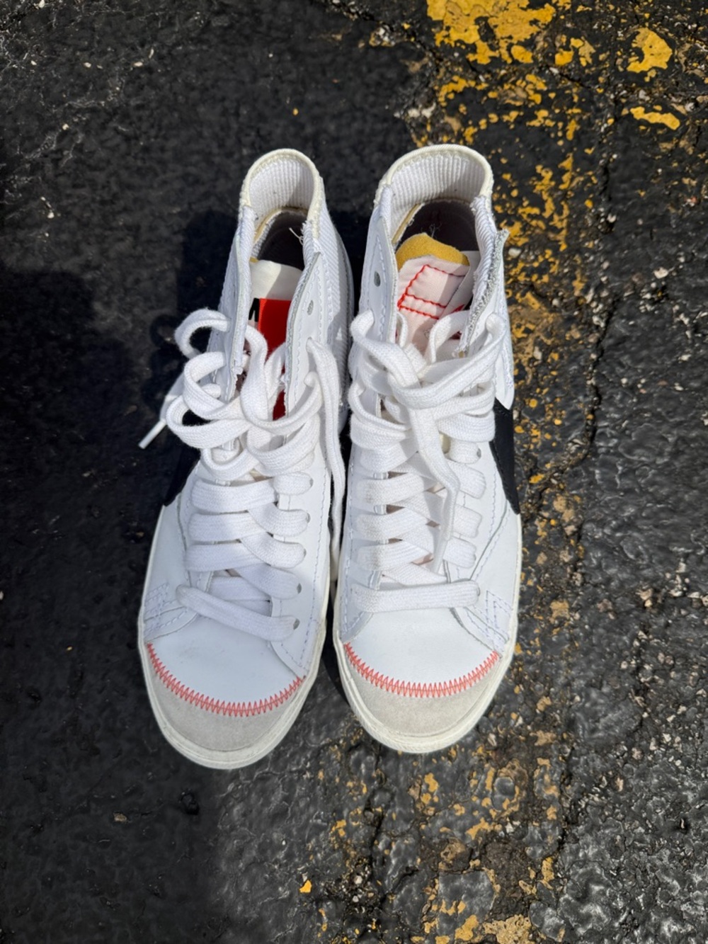 Nike White High-Top Athletic Sneakers with Black Swoosh and Red Stitching